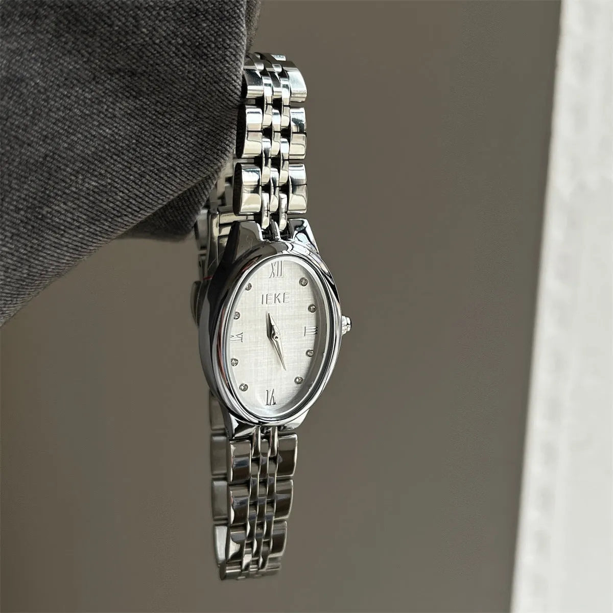 Oval dial ladies watch with dot markers, 37mm, gold strap and gold face