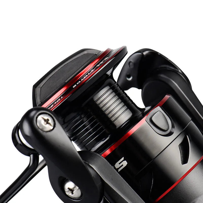 All-metal fishing reel attached to telescopic fishing rod in collapsed position