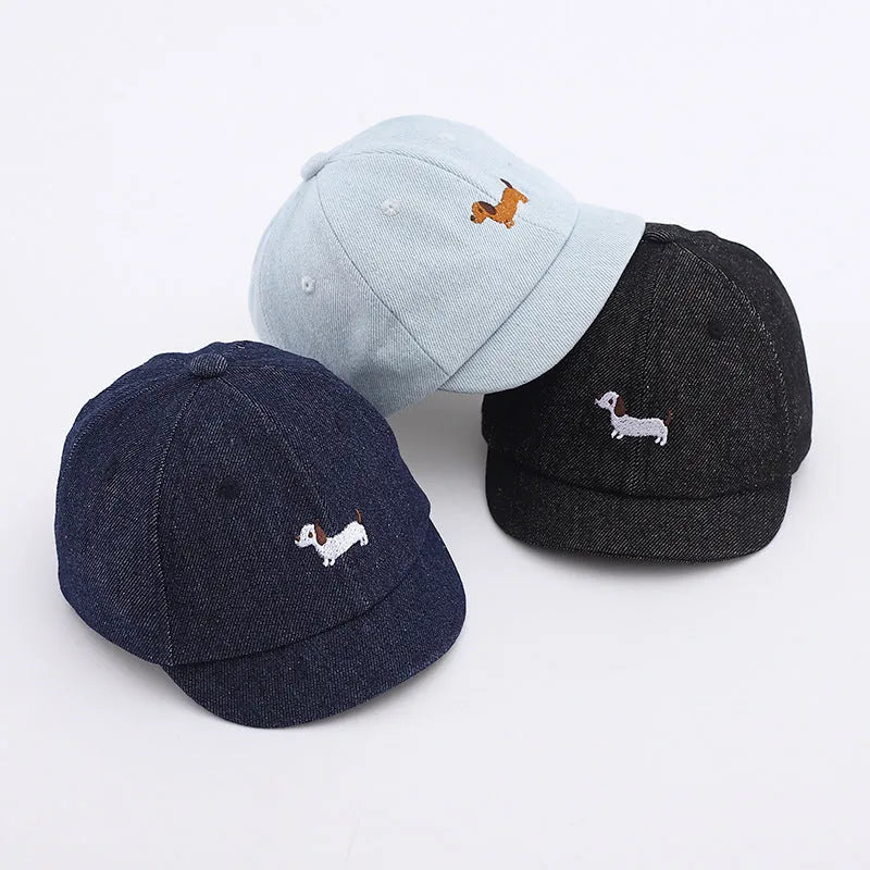 Babies denim puppy baseball cap with short brim and dome crown in light blue, dark blue, or black, 48cm size
