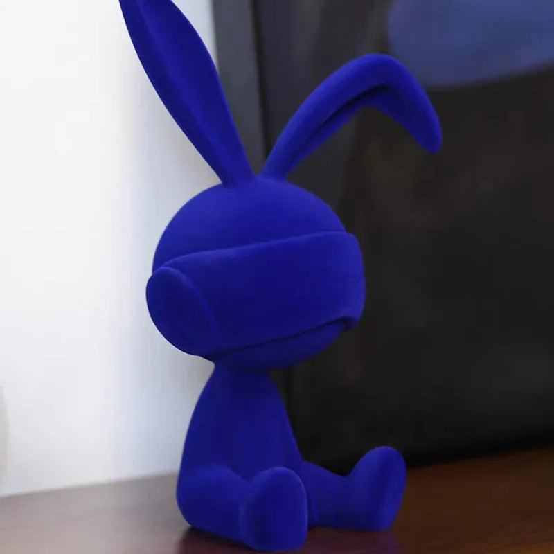 Suede blindfold rabbit resin table ornament in choice of blue, green, or red colours.
