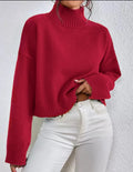 Loose versatile basic women's pullover in gray, showing thread texture and relaxed fit