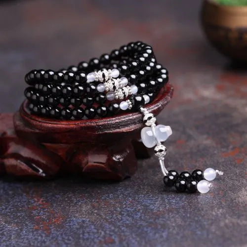Natural black and red agate 108-bead bracelet with geometric shapes