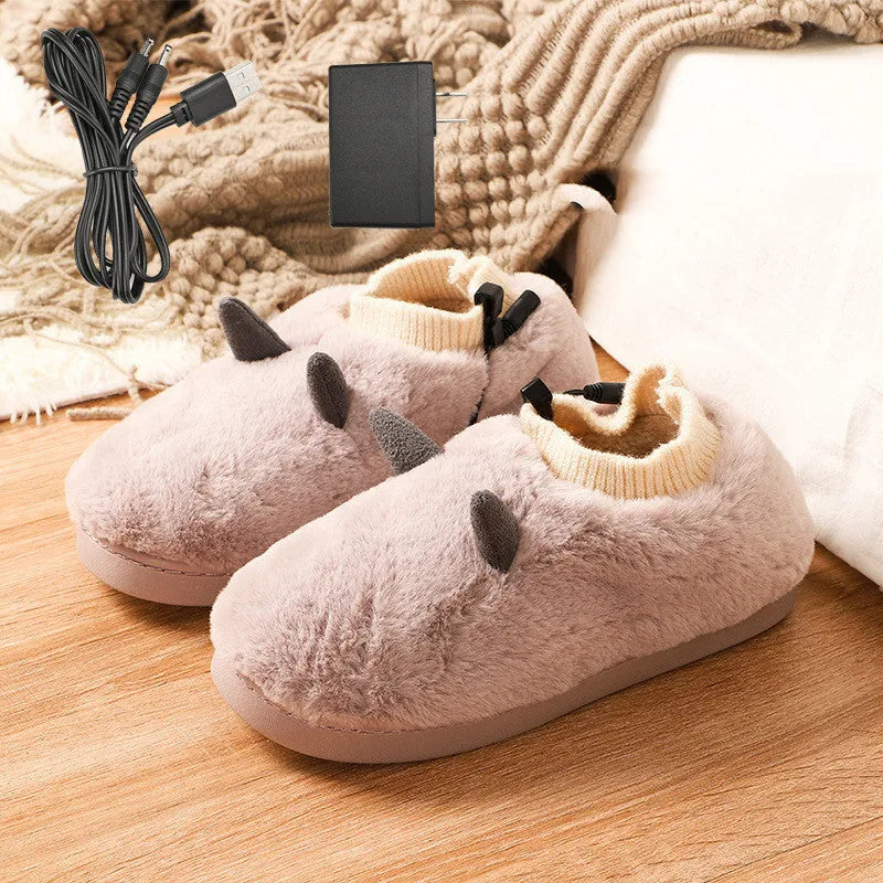 USB electric foot warmer slippers in grey with a connected USB cable on a wooden floor.