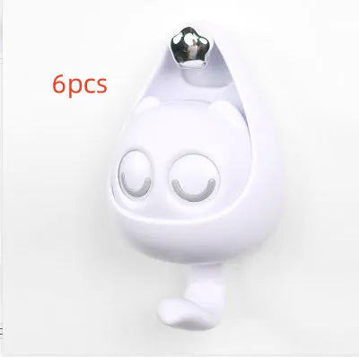 Cream white cat-shaped adhesive wall hook with winking eyes, 2.5kg capacity, 105x61x45mm