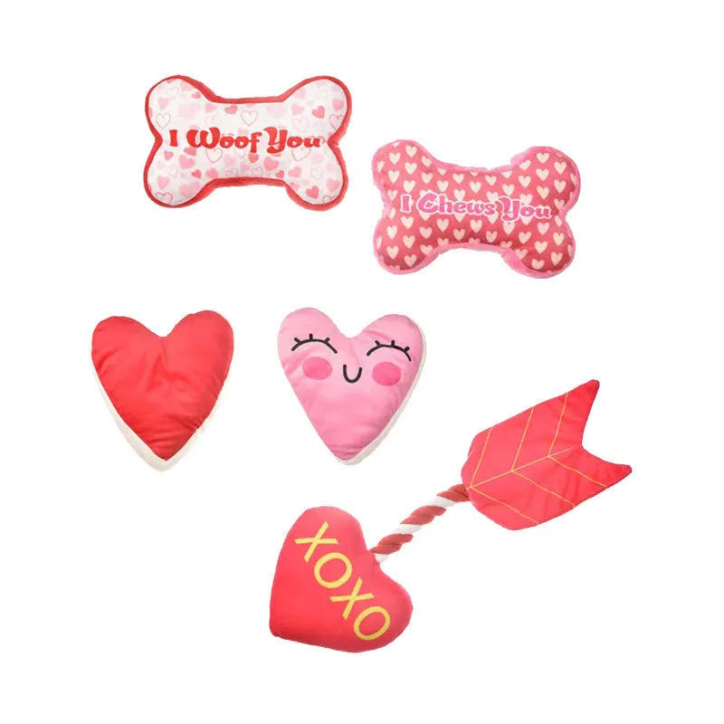 Plush dog chew toy with squeaker in bone pink colour on a white background