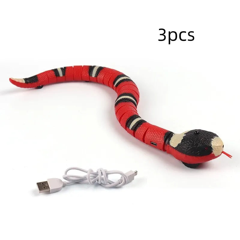 Smart sensing interactive snake cat toy with segmented plastic body and USB charging