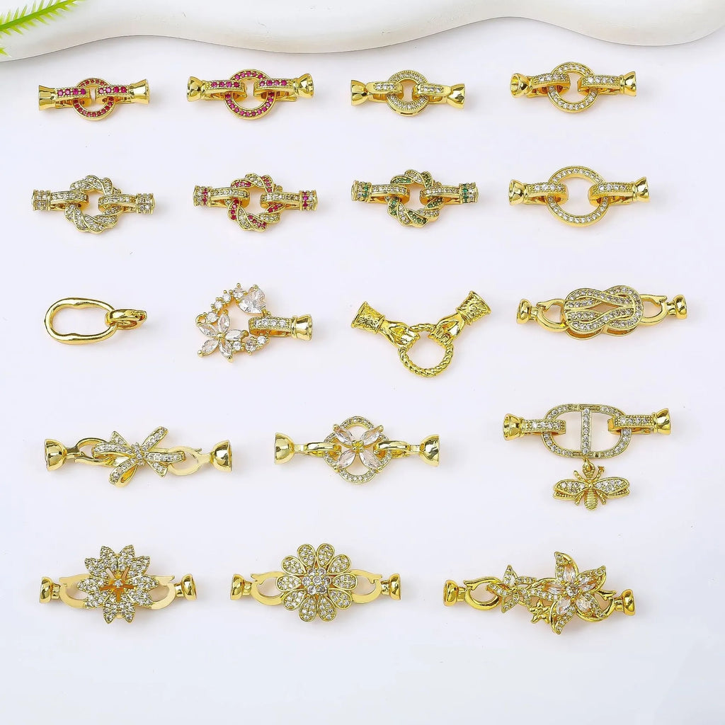 Small gold-colour electroplated metal jewellery buckle clasp on a white background.