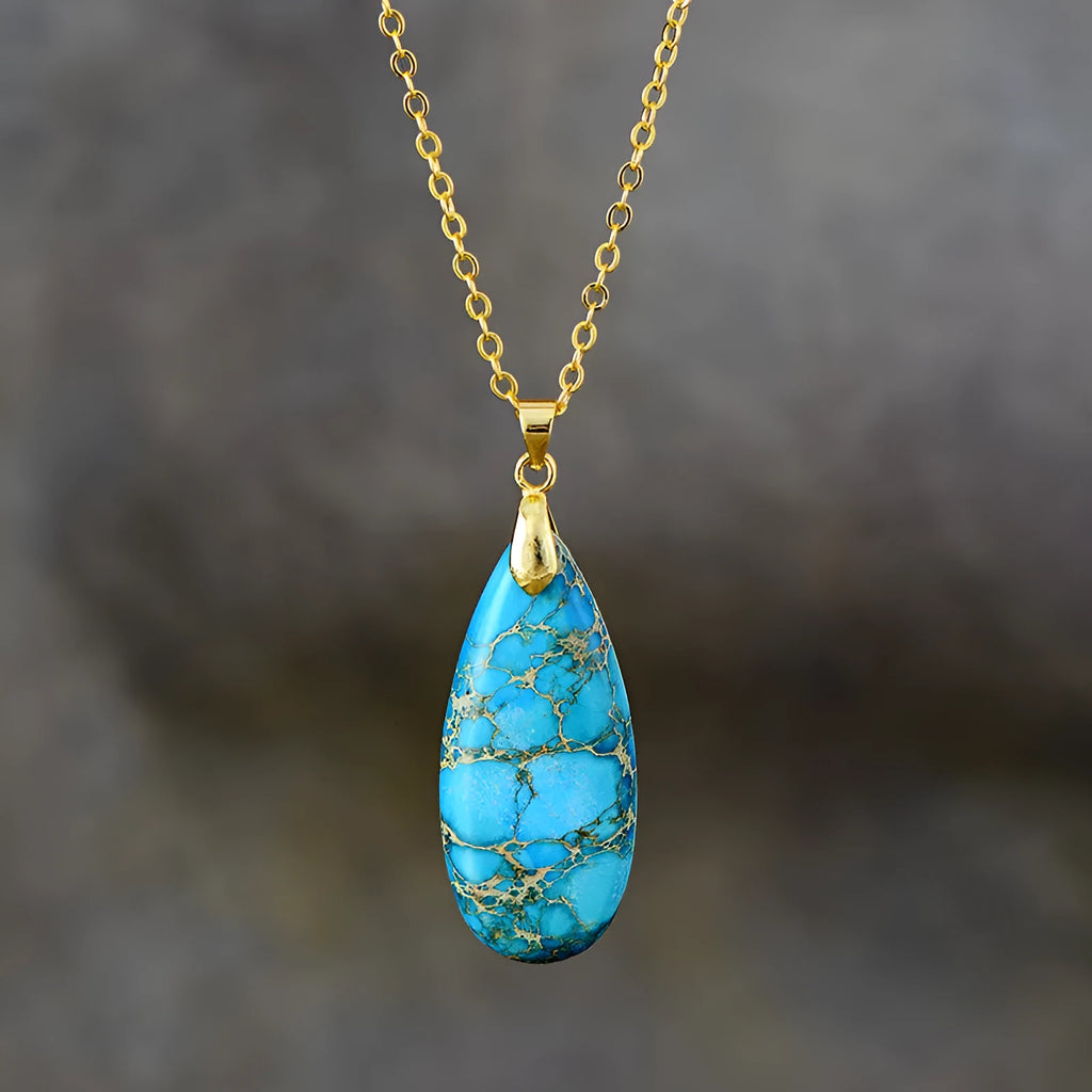 Emperor Stone water drop pendant necklace with genuine jade centre and 18K gold plated setting on a chain.