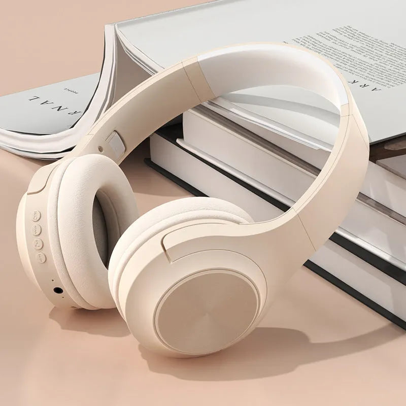Creative wireless Bluetooth headset in Chalk Black colour with charging case on a table.