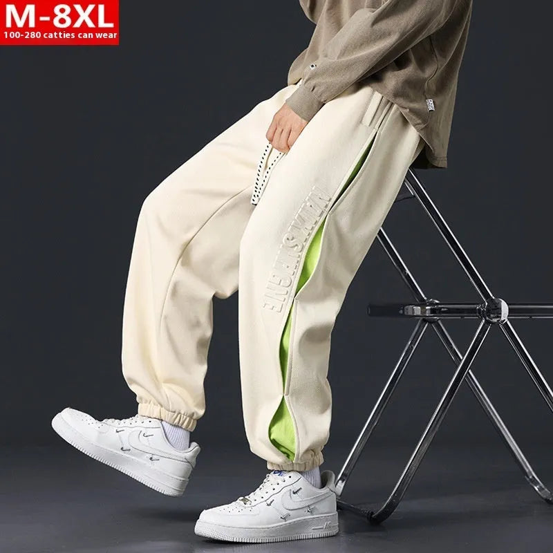 Men's loose-fit cotton trousers with ankle banded design in grey green colour