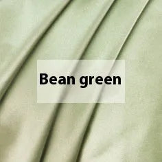 Double-sided solid colour silk duvet cover in bright brown laid flat on a bed.