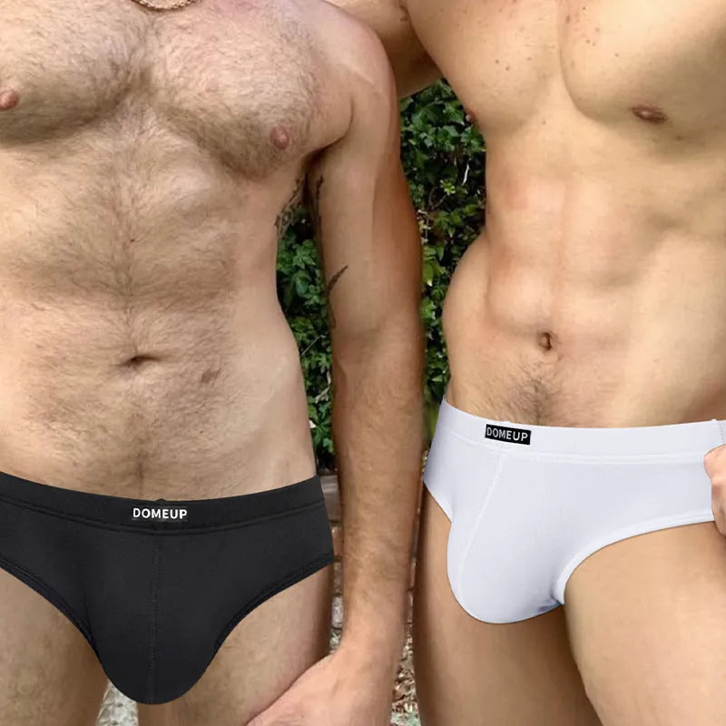 Men's solid colour low waist seamless briefs in white, black, and pink on a size chart.