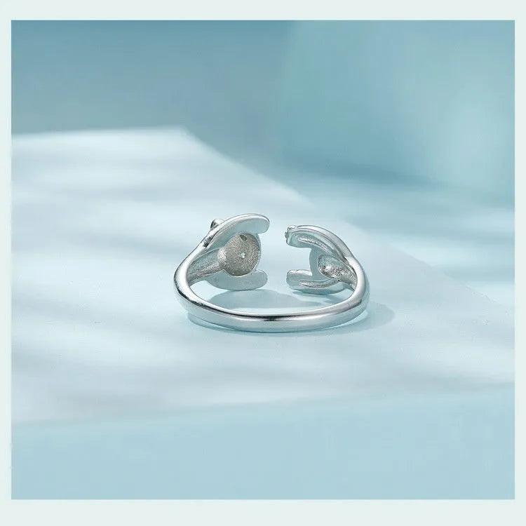 Adjustable sterling silver panda ring with white gold plating on an open band.