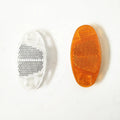 Yellow and white bicycle reflector decorations showing front and rear spoke mounting for night-time visibility