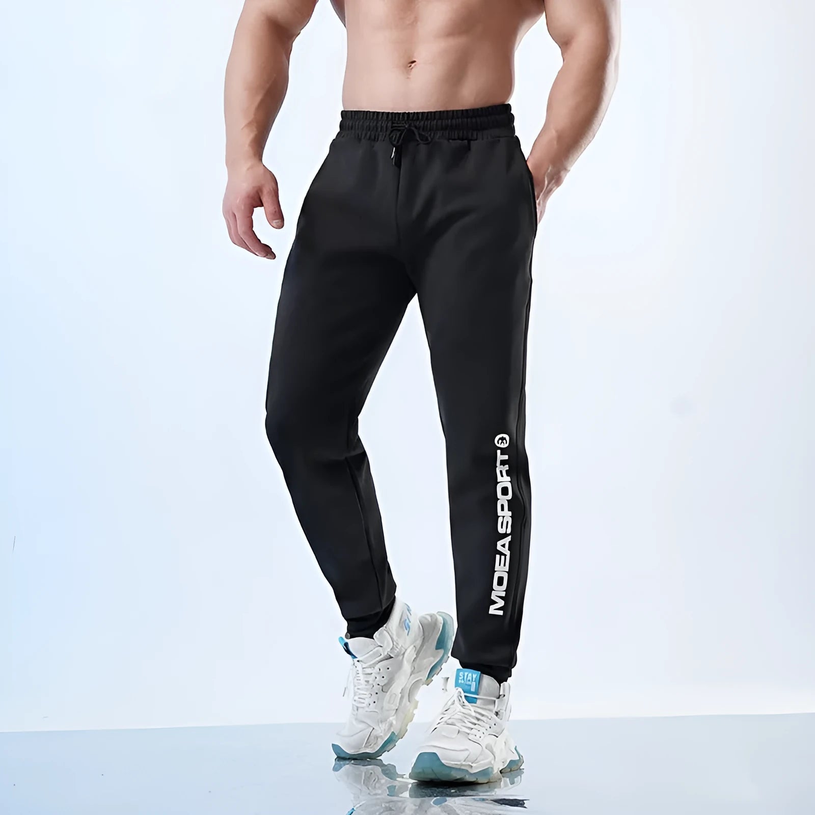 Men's black ankle-tied sweatpants with mid waist design for casual sports wear