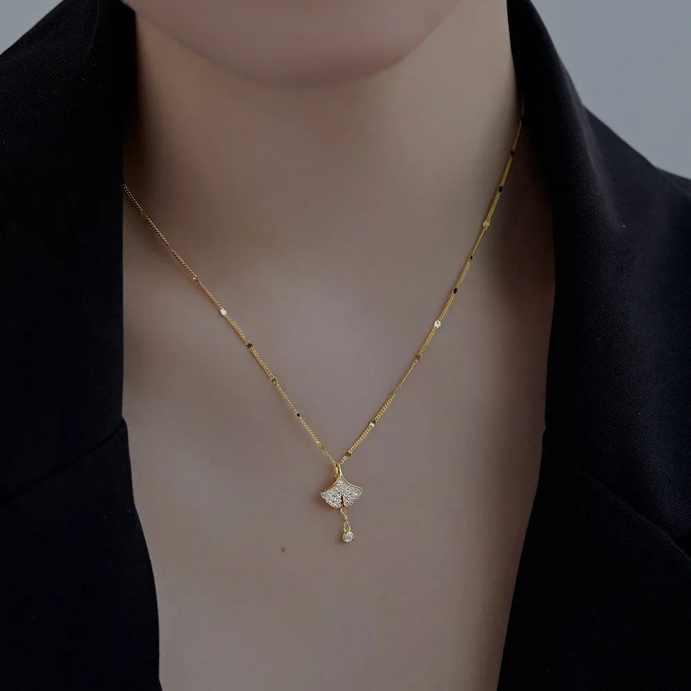 S925 sterling silver necklace with ginkgo leaf pendant in gold finish on curbs chain for women