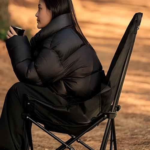 Night Black folding camping recliner chair with removable cover, shown in a portable stool design.