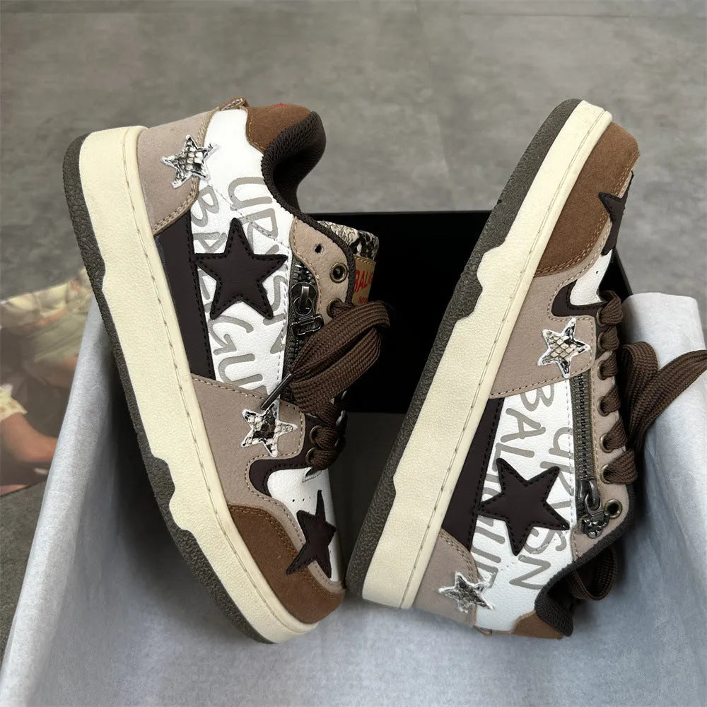 Brown candy colour low-top sneakers with rubber sole and lace-up front on a neutral background