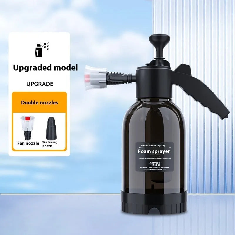 Black handheld 2L foam watering can sprayer with two nozzles and a comfort-grip handle.