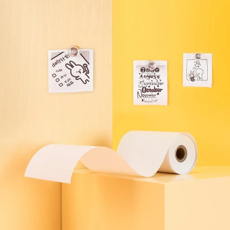 Three rolls of 57mm thermal paper in packaging for small thermal printers