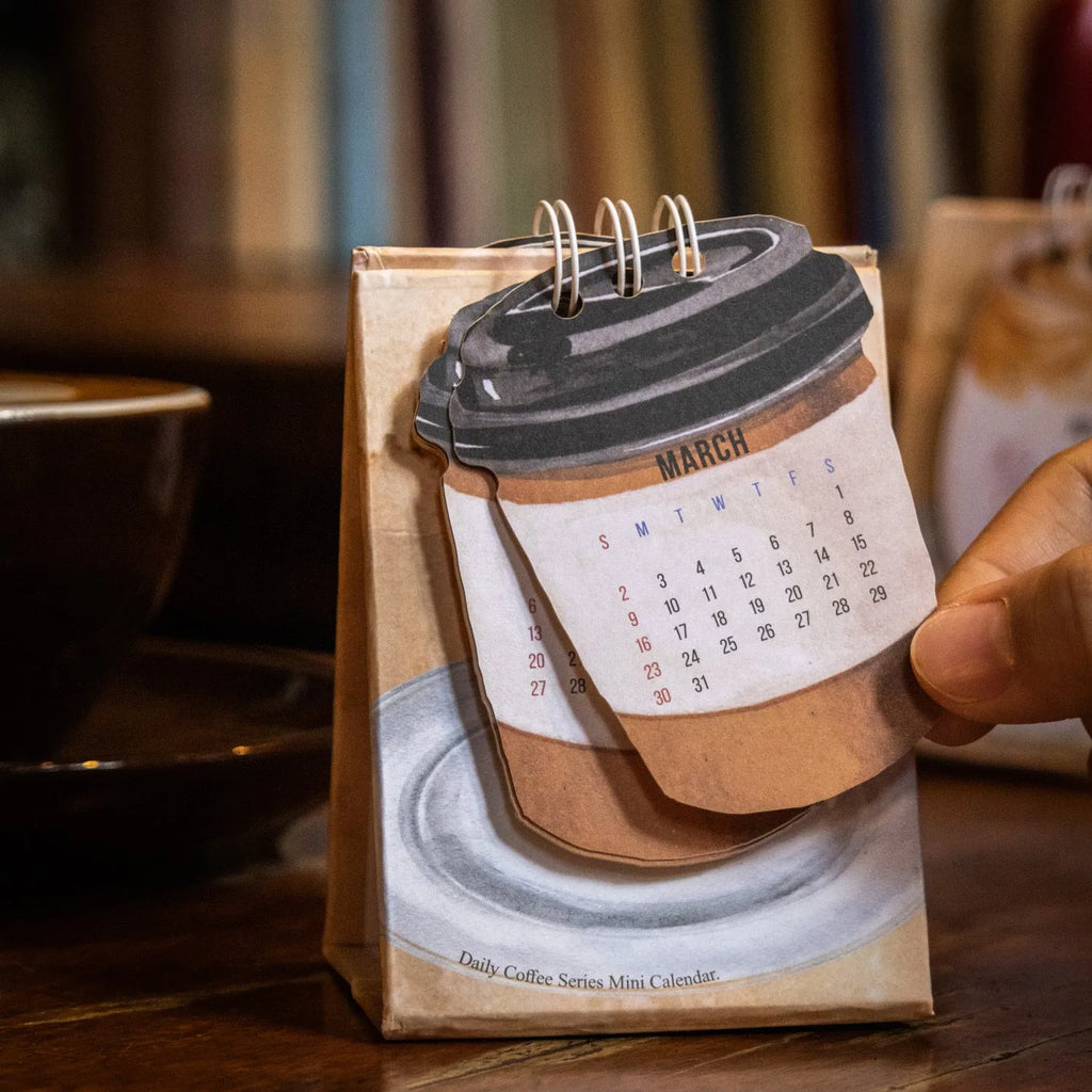 Mini 2025 desk calendar with themed designs for small desk spaces