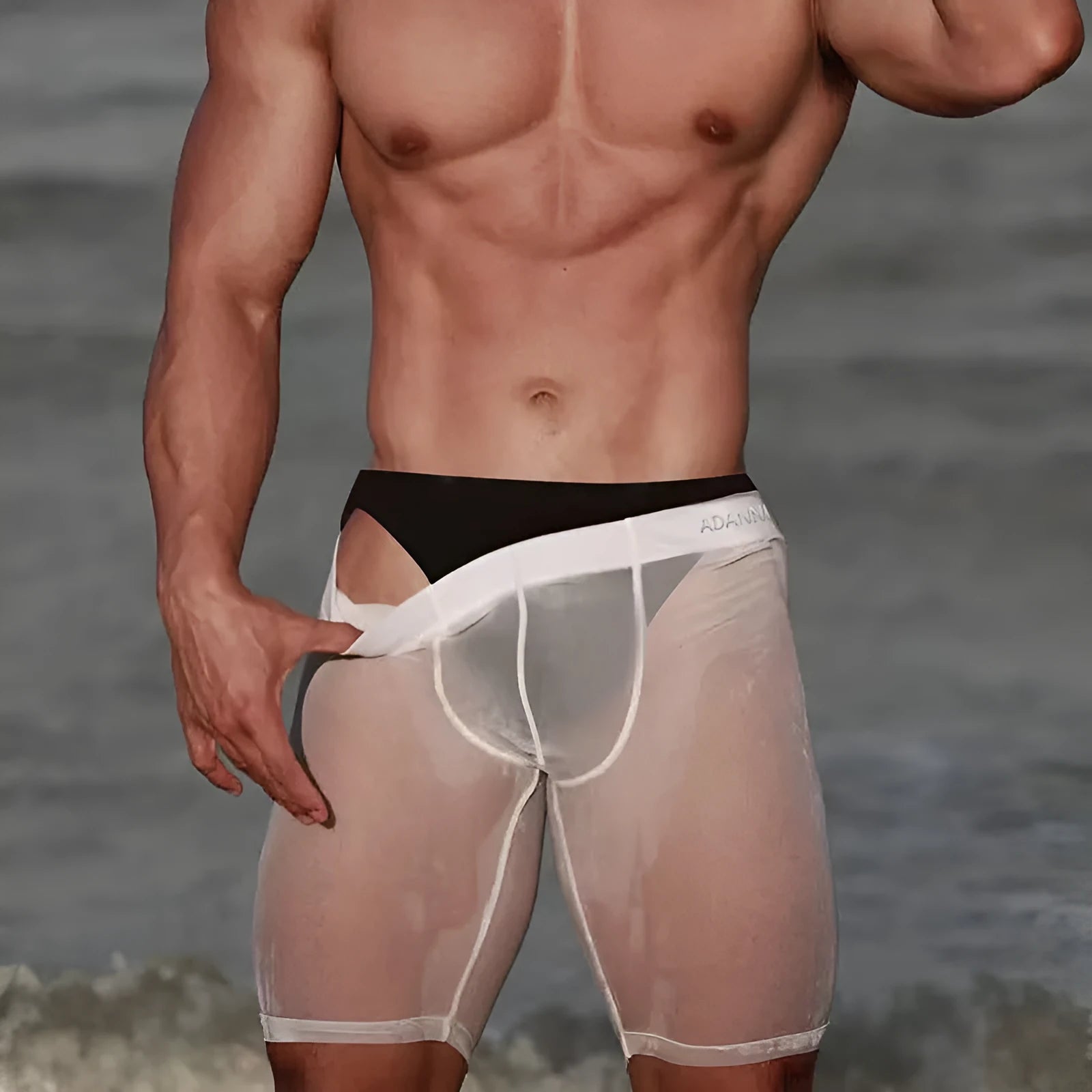 Men's solid colour mesh shorts in knitted nylon fabric, shown in black, white, and pink.