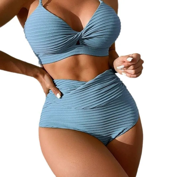 Women's solid colour two-piece bikini swimsuit in polyester fabric on a neutral background.