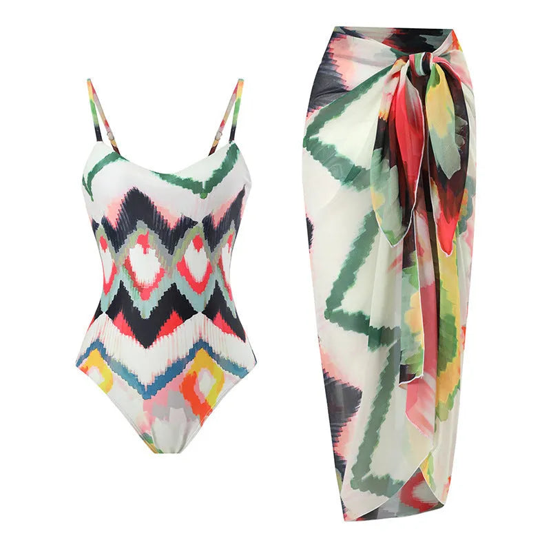 Women's two-piece swimsuit set with matching hip skirt in printed pattern