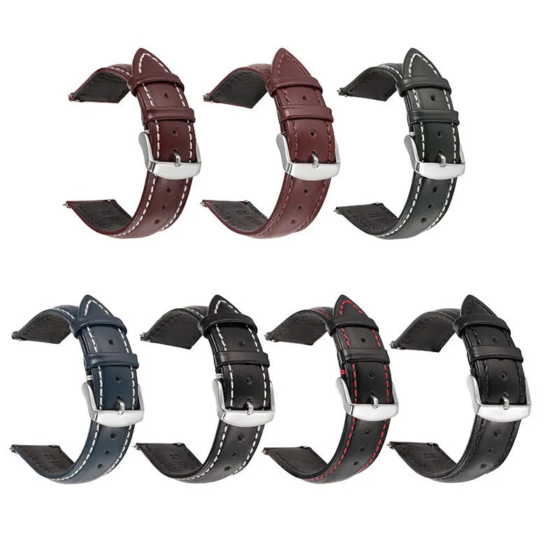 Quick release watch strap in black cowhide leather with white contrast stitching, shown detached from a watch.