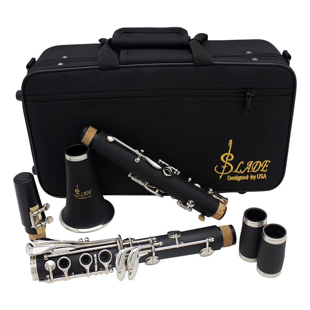 Black beginner B-flat clarinet with 17 nickel keys and a Bakelite body next to its carrying bag.