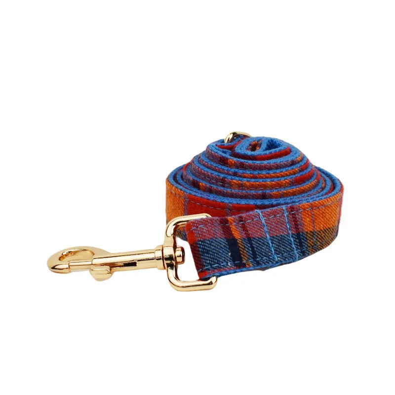 Blue background velvet plaid dog collar with matching hand-holding rope and optional bow accessory