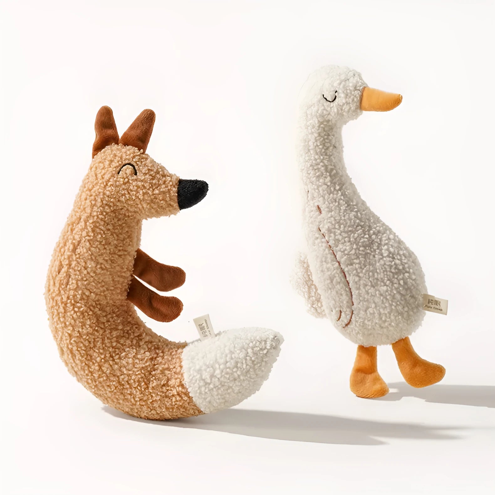 Cartoon fox and duckling pet chew toys with soft plush fabric and crinkly sound filling