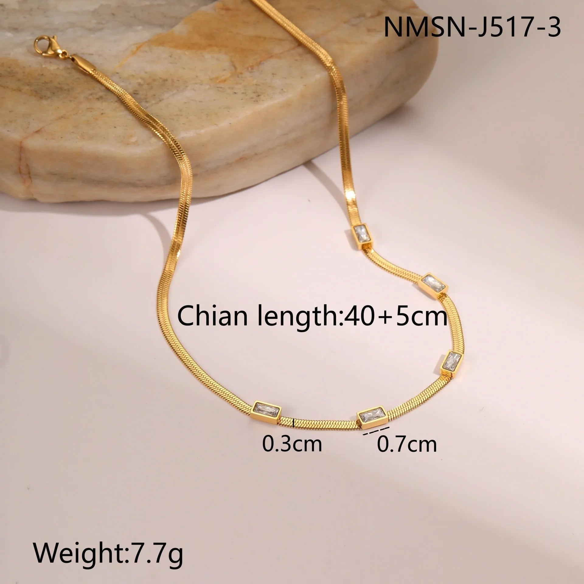 Geometric square zircon pendant on a flat stainless steel snake chain necklace in gold or steel colour.