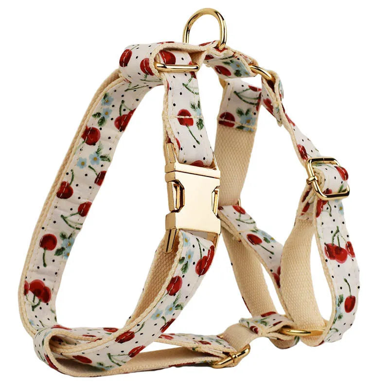 Red cherry printed dog collar and leash set with light gold buckle and bow on cloth material