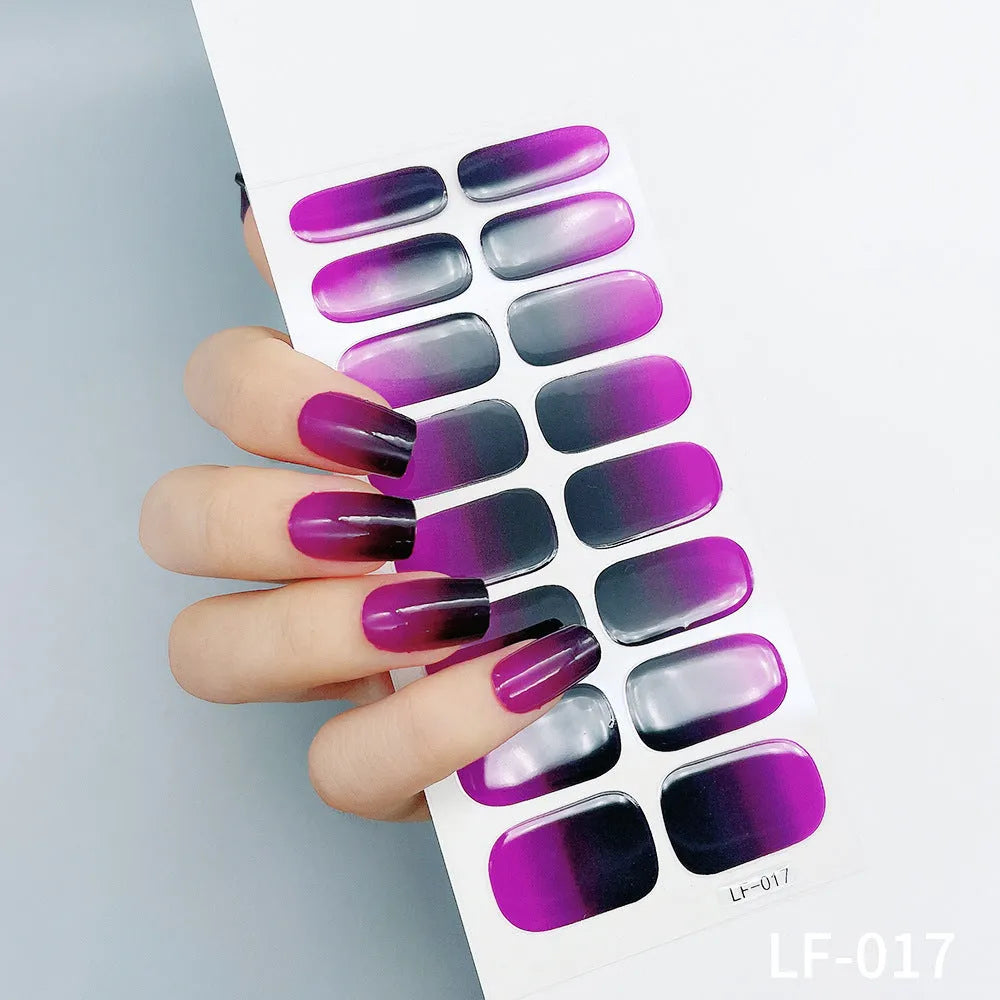16 solid colour full nail art stickers with 22 patterns including cross, rose, butterfly designs in 12x6mm oval size