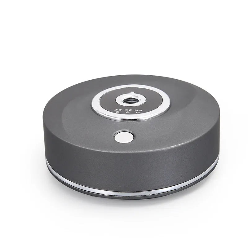 Car air freshener spray accessory with USB charging port mounted on vehicle dashboard