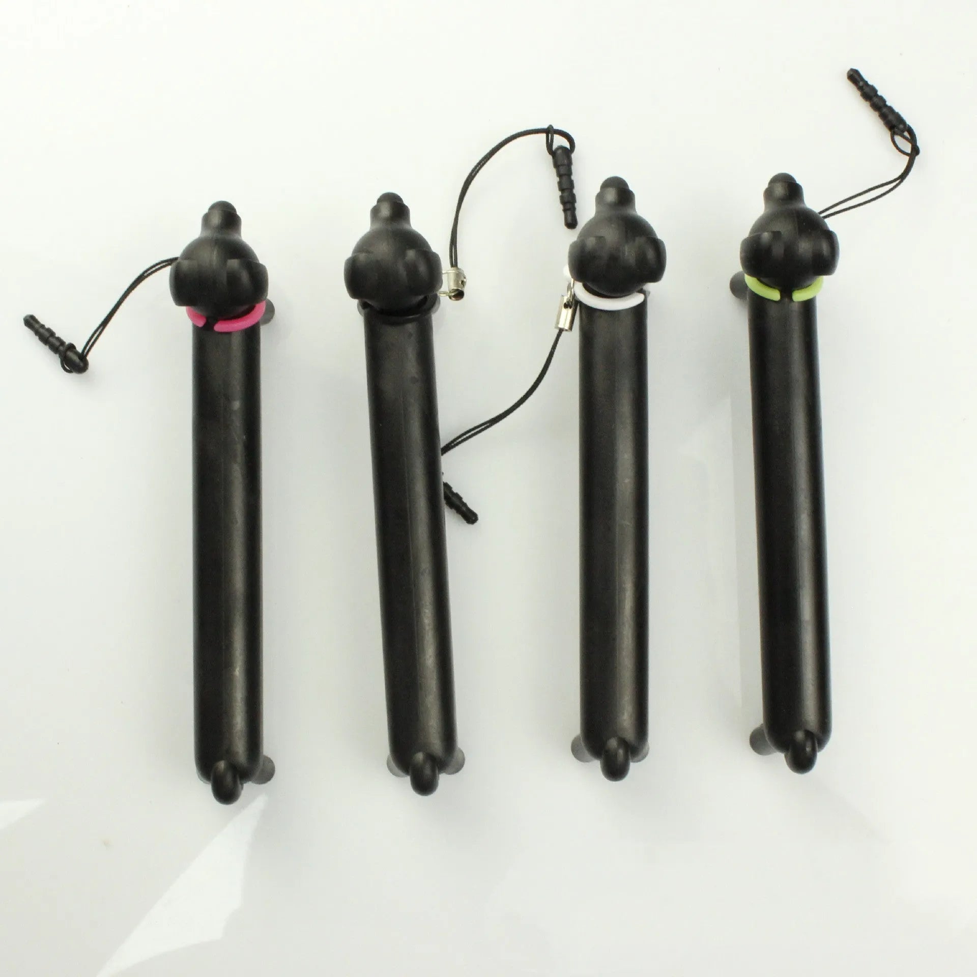 Black dog-shaped touch screen stylus showing phone holder conversion and length adjustment