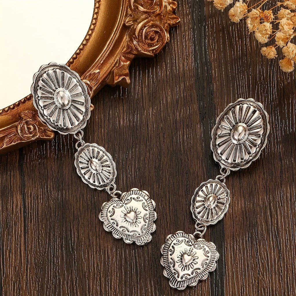 Pair of silver-toned vintage tassel water droplet shaped long chain drop earrings with hook fastening