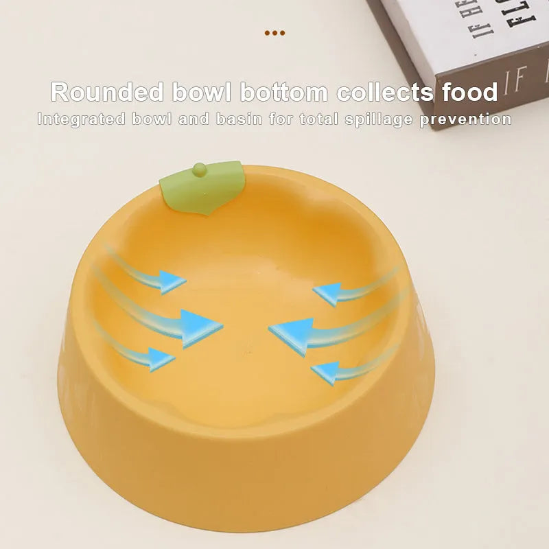 Green plastic double pet bowl for cats and small dogs on a floor.