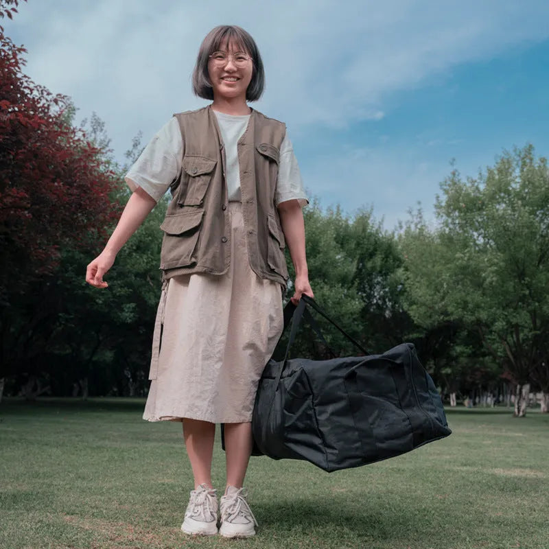 Green heavy-duty waterproof storage bag for folding camping chairs and tables, shown folded and expanded.