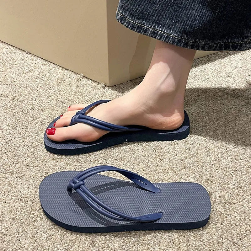 Men's PVC toe-covering flip flops in beige colour on a plain background.