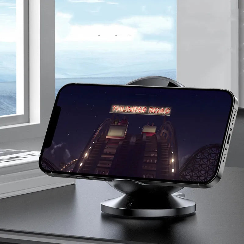 Black multifunctional Bluetooth speaker with integrated wireless phone charging pad on top.