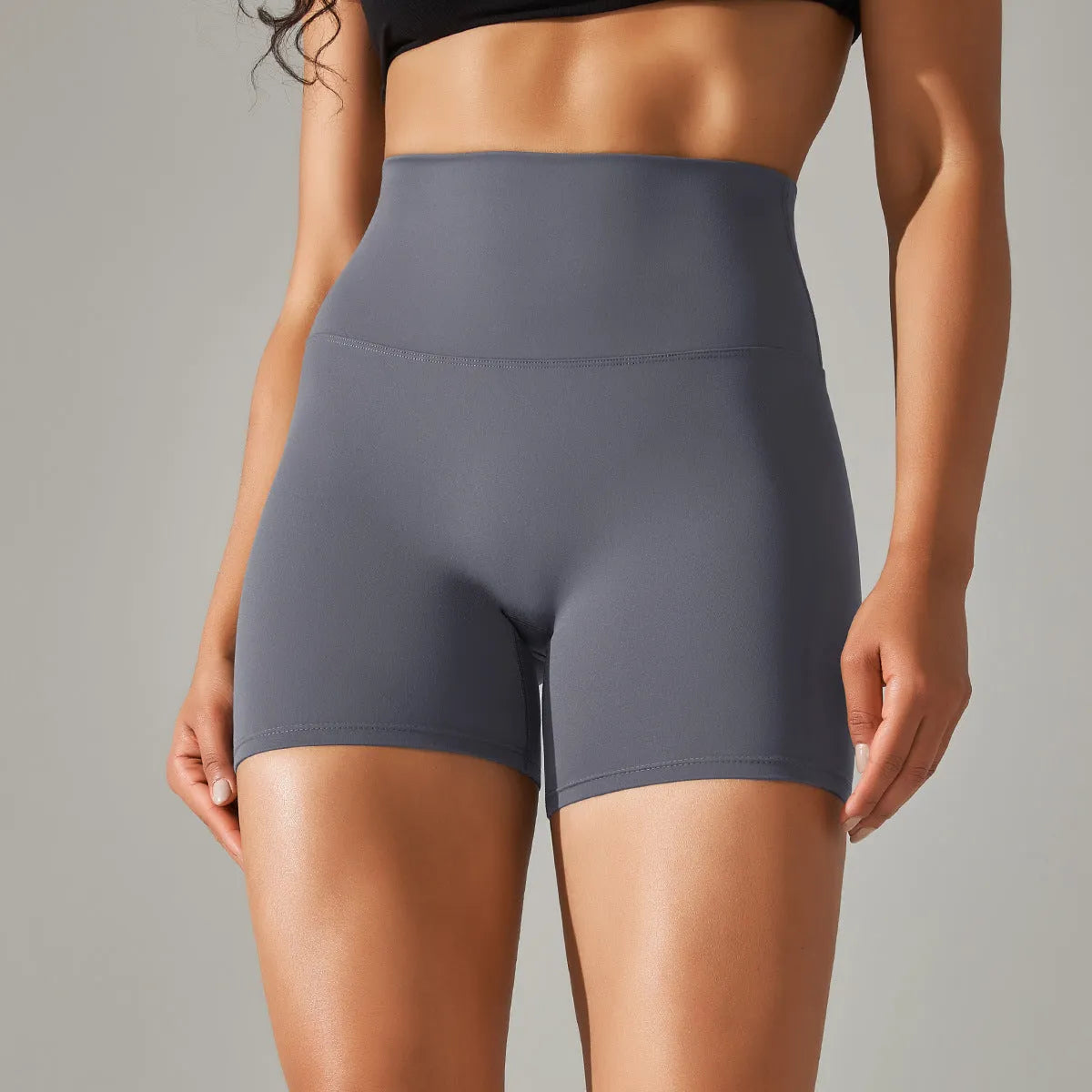 Women's high waist fitness tights in dark green colour with belly contracting design and hip lift construction