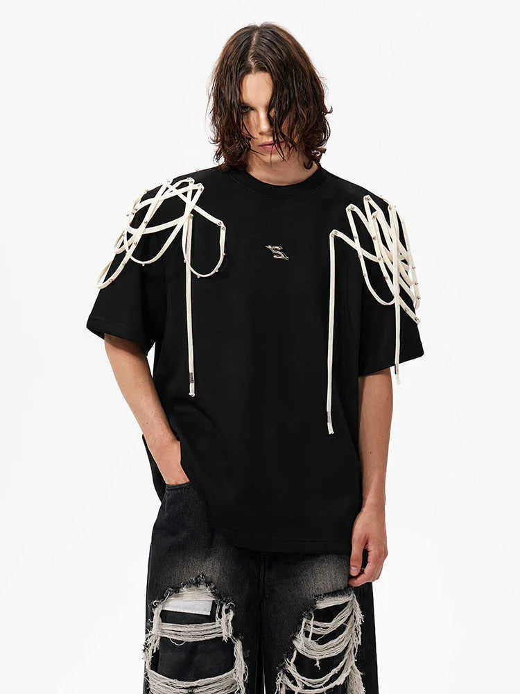 Black loose fit women's T-shirt with padded shoulders featuring rivet ribbon detail