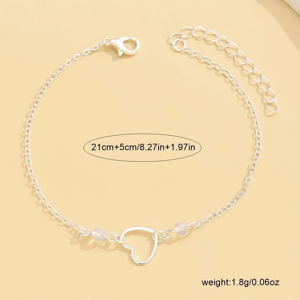 Adjustable alloy anklet with small heart pendant in gold or silver finish