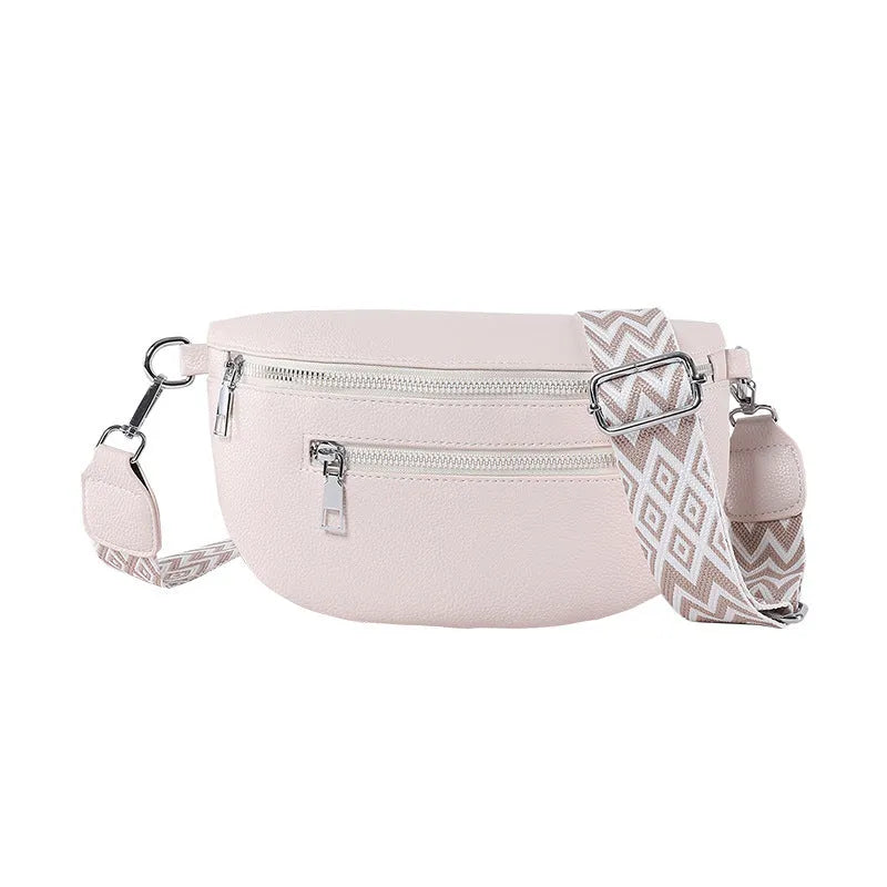 Soft PU leather oval shoulder crossbody bag, 24.5 x 14.5 x 8 cm, with single strap and slit pocket.