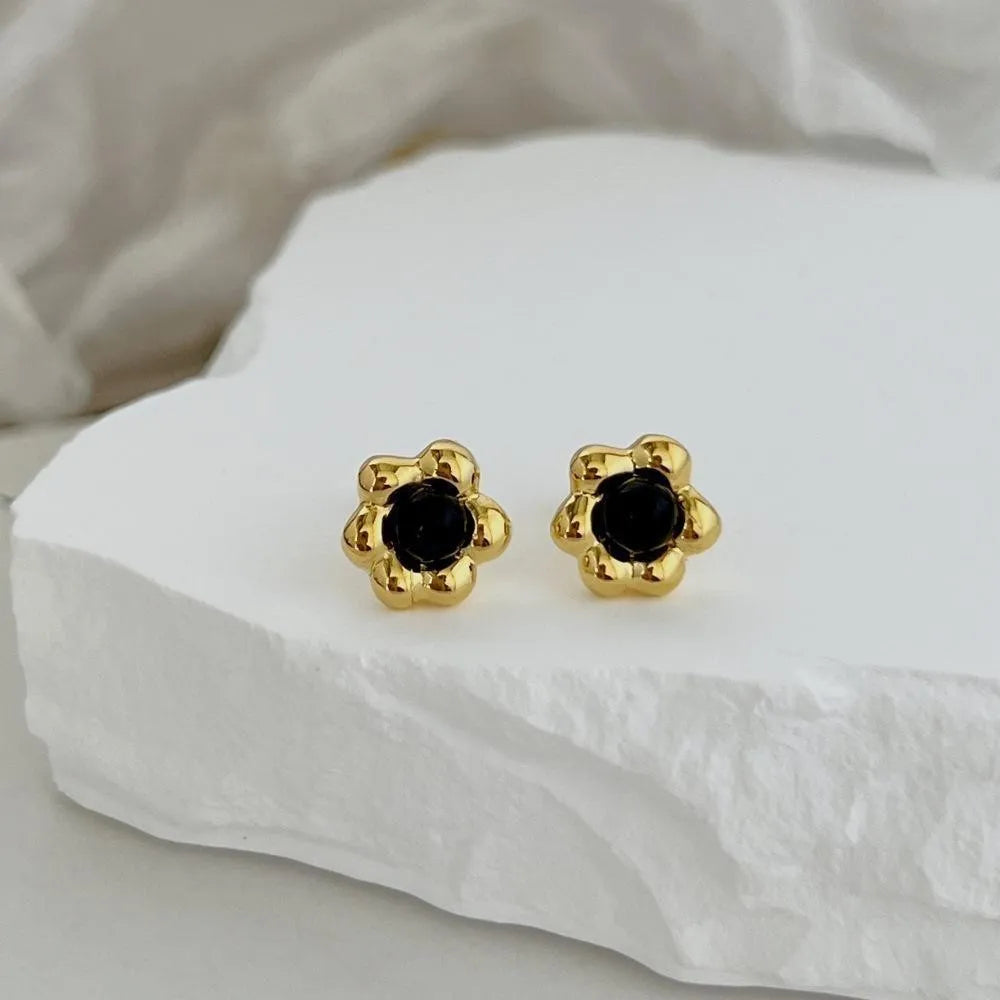 S925 sterling silver black agate flower ear studs in gold colour close up