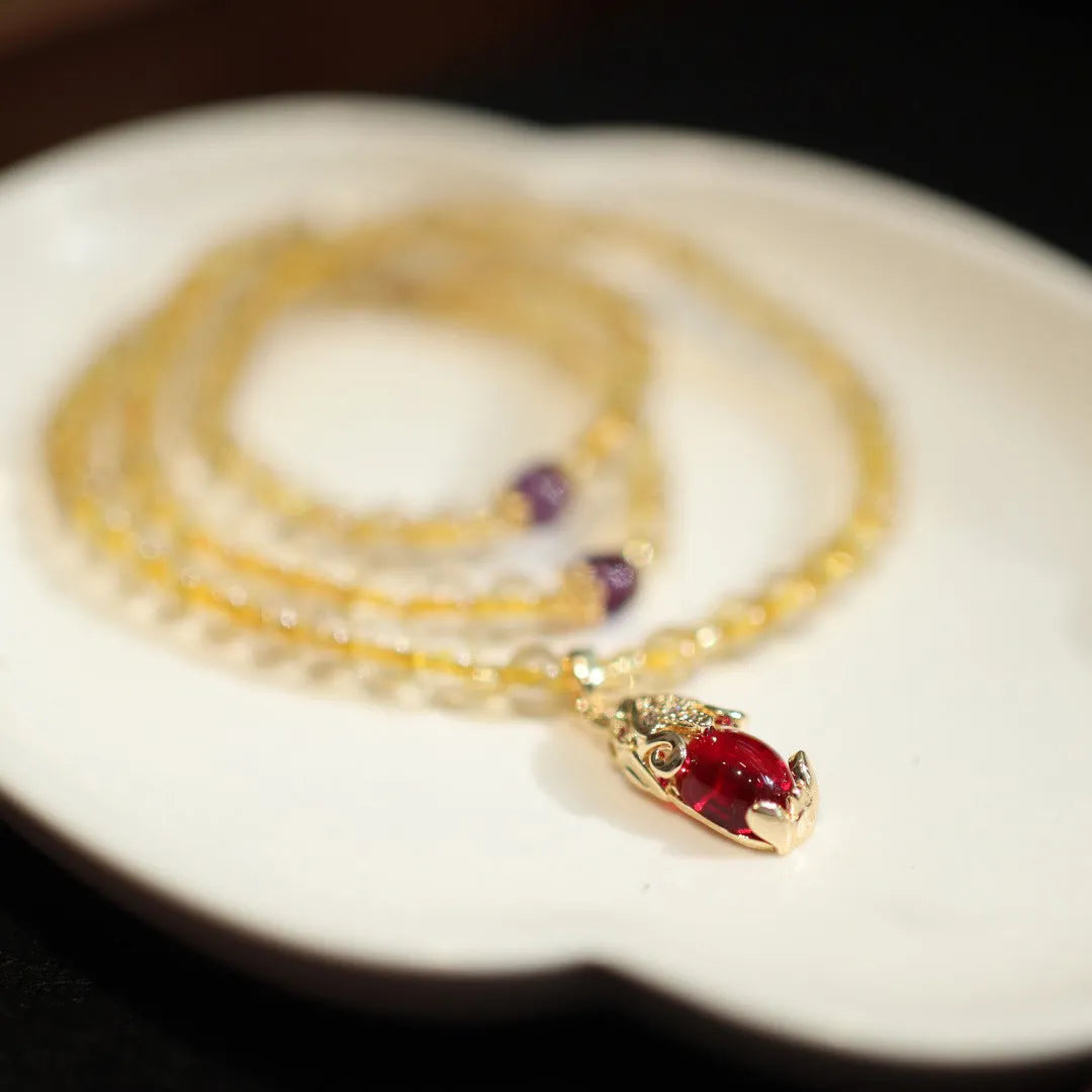 Natural Brazil gold rutilated quartz bracelet with three circular accents and Chinese-style hanging chopsticks design