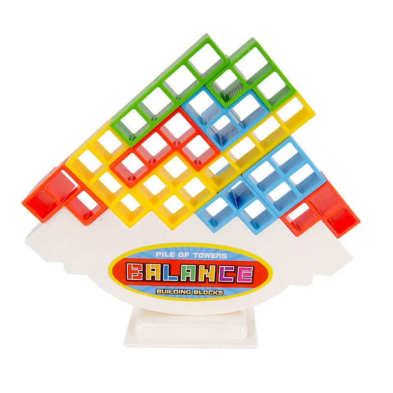 Plastic balance stacking game with coloured blocks on a tilting base, packed in a 26.5 cm box.