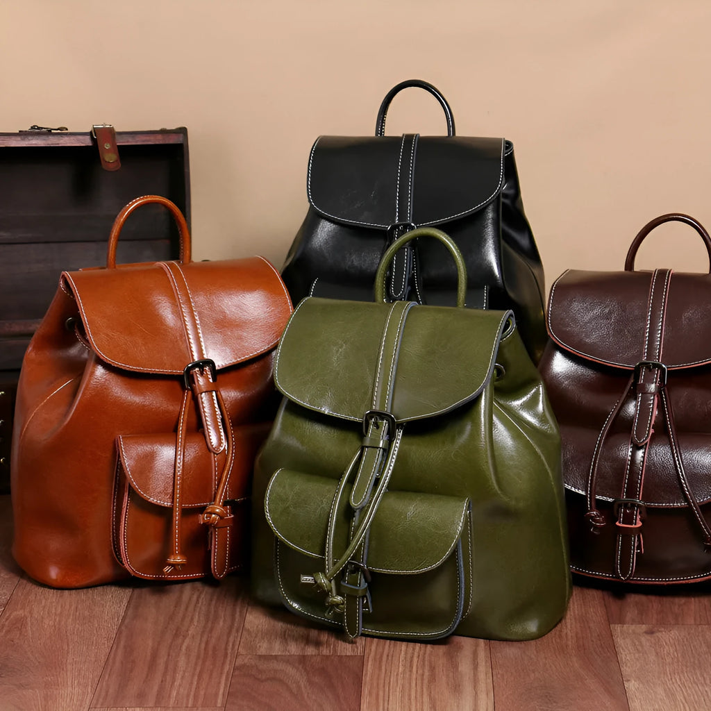 Korean style brown cowhide leather backpack with pull-belt fastening and front sandwich pocket.